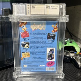 Trog! - WATA 9.8 A+ Sealed (NES 1991) Dot-Gobbling Dinos Meet NES Mayhem