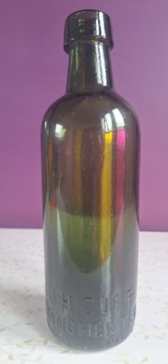 Decorative late Victorian 1910's J H Cuff Manchester Green Glass Bottle