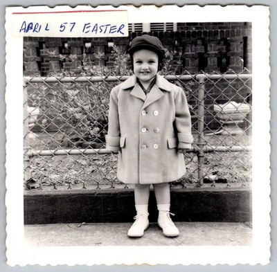Vtg B&W Snapshot Cute Smiling Boy In Oversized Dress Coat & Hat Fence Easter