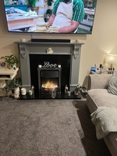 Electric Fire And Surround With Black Granite Hearth  And Back.