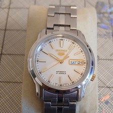 Seiko 5 7S26 montre homme automatique 21 rubis jour/date cadran blanc acier
