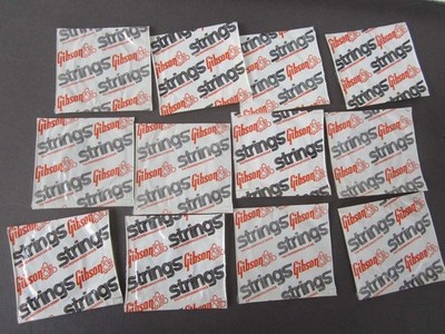 Lot of 13 Gibson Tenor Banjo Mona Steel loop end strings - in orig sealed packs