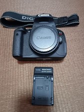 Canon EOS 7i Digital SLR Camera Body with Battery Charger and Strap