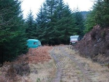 Photo 6x4 Caravans in the forest Gartnagrenach Probably used by gamekeepe c2010