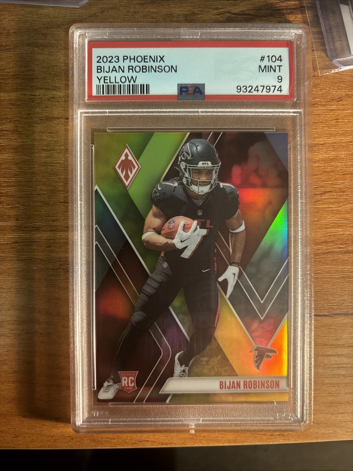 2023 Panini Phoenix - Rookies Bijan Robinson #104 Yellow /75 (RC)