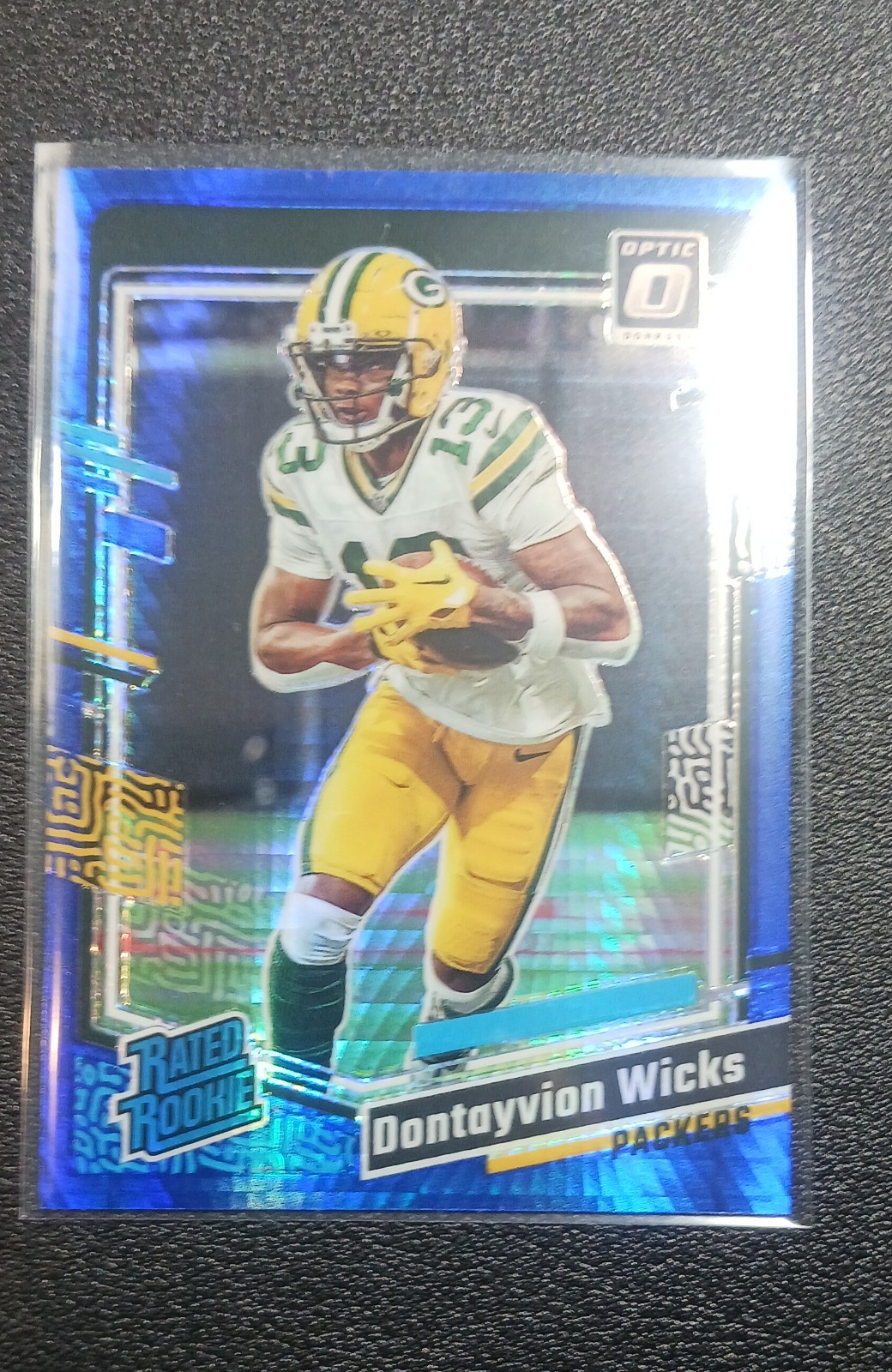 2023 Panini Donruss Optic - Rated Rookie Dontayvion Wicks #249 Blue Hyper Prizm