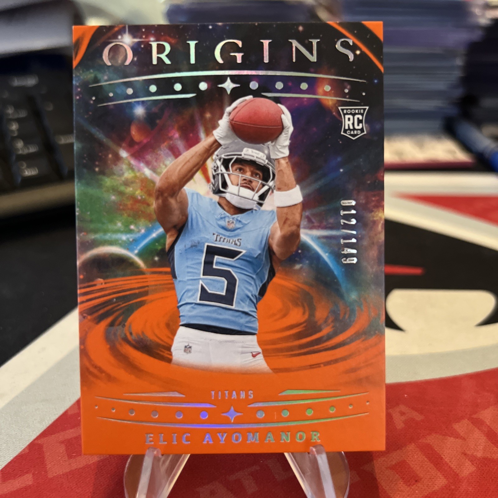 2025 Panini Origins Elic Ayomanor #108 (RC) Rookie Orange /149 TITANS