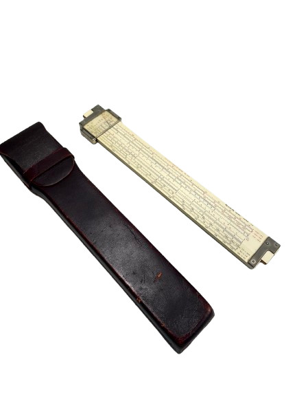 A bamboo slide rule from Japan with a leather case — pre-digital computing made from actual bamboo, which is as tactile and nerdy as it gets.