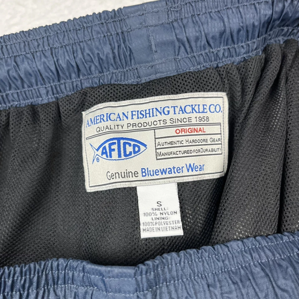 Pantalones cortavientos de pesca AFTCO Bluewater de nailon resistentes al agua para hombre pequeños Foto 3 de 4