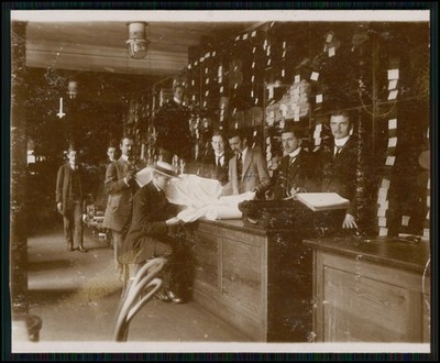Photo postcard Berlin cloth goods shop 1912 bales of various fabrics textiles