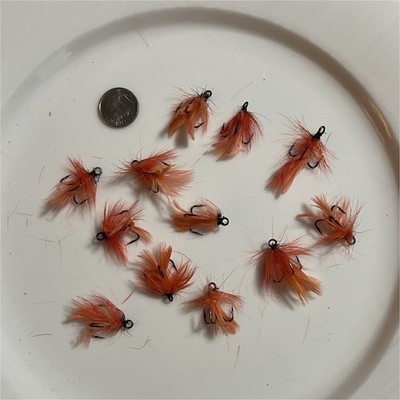 12 hand tied Orange Feather size 8 treble hooks