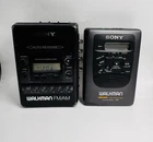 Lot of 2 Sony Walkman Cassette Players WM-FX52 & FM/AM Auto ReveFor Parts/Repair