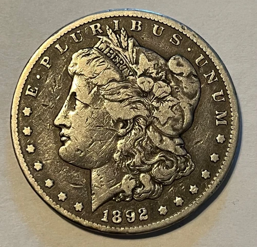 1892- CC Morgan silver dollar,  Strong Fine, better date