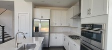 White kitchen Cabinets shaker style with Stainless Steel Appliances
