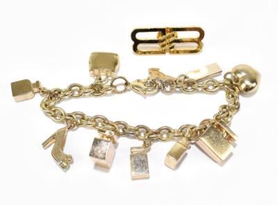 Dolce Gabbana gold tone charm bracelet with Ten charms in velvet