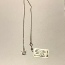 R.H. Macy & Co 925 Sterling Silver 1/10ctw Diamond Star Pendant Necklace
