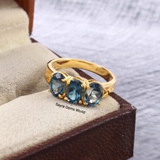 Oval Blue Gemstone London Topaz Ring : Golde Plated Band, Triple Stone Ring