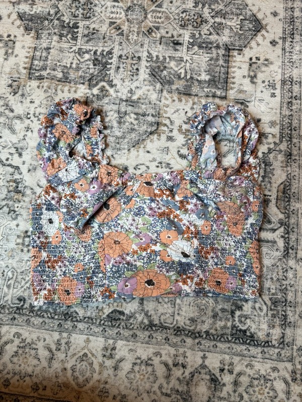 Japan floral print puff sleeve top with a smocked bodice.