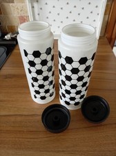 2 Football Mugs. 1 Backpack. 1 Pair Of Swimming Trunks.