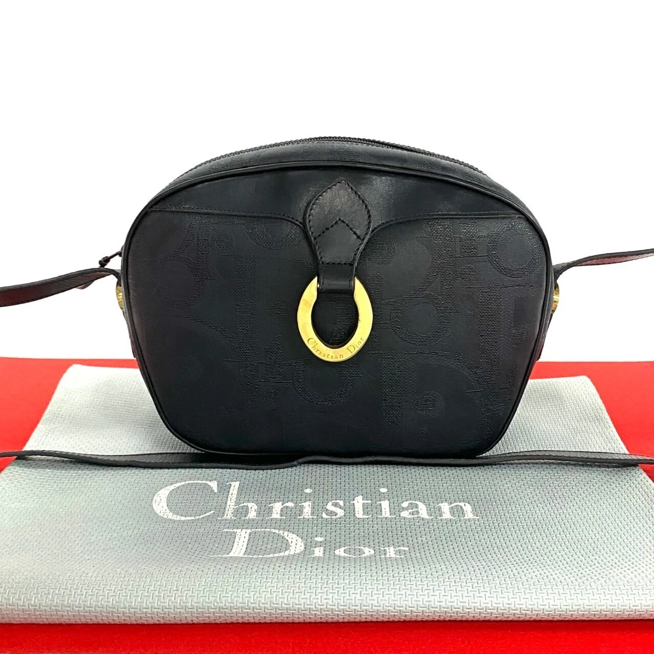 Sac bandoulière Christian Dior logo métal motif trotteur cuir PVC noir 28179