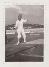 Vintage Photo of Fencer in Full Gear and Armor Capturing the Sport’s Elegance