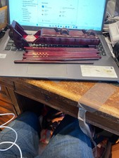 really attractive red wooden tortoise box containing chop sticks