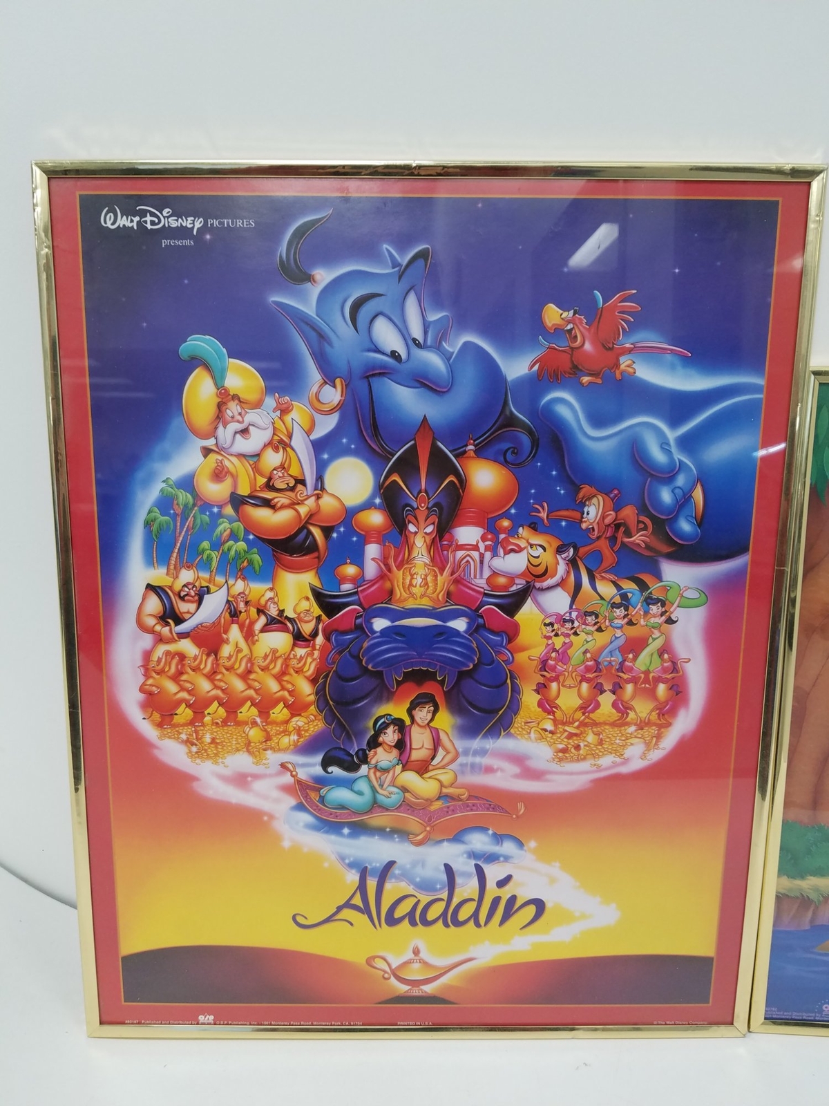 Collection of 2 Walt Disney Framed Movie Posters Aladdin and Pocahontas