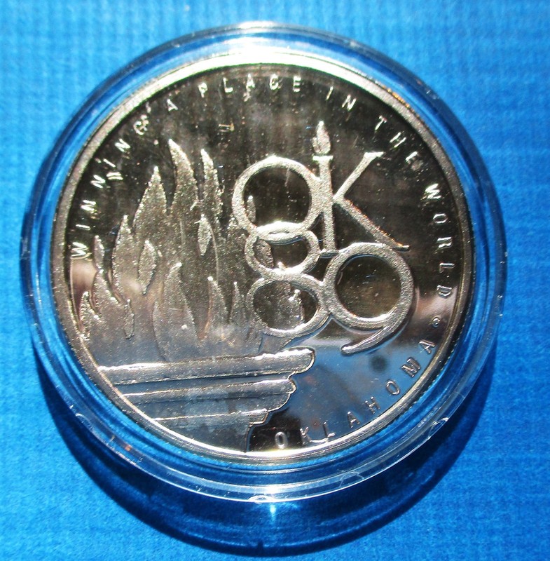1989 ONE TROY OUNCE SILVER U.S. OLYMPIC OKLAHOMA FESTIVAL MEDAL COIN. IN CAPSULE