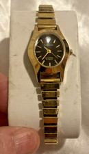 Mujer-Reloj-Armitron Diamante Cuarzo Tono Dorado Reloj Elástico Esfera Negra