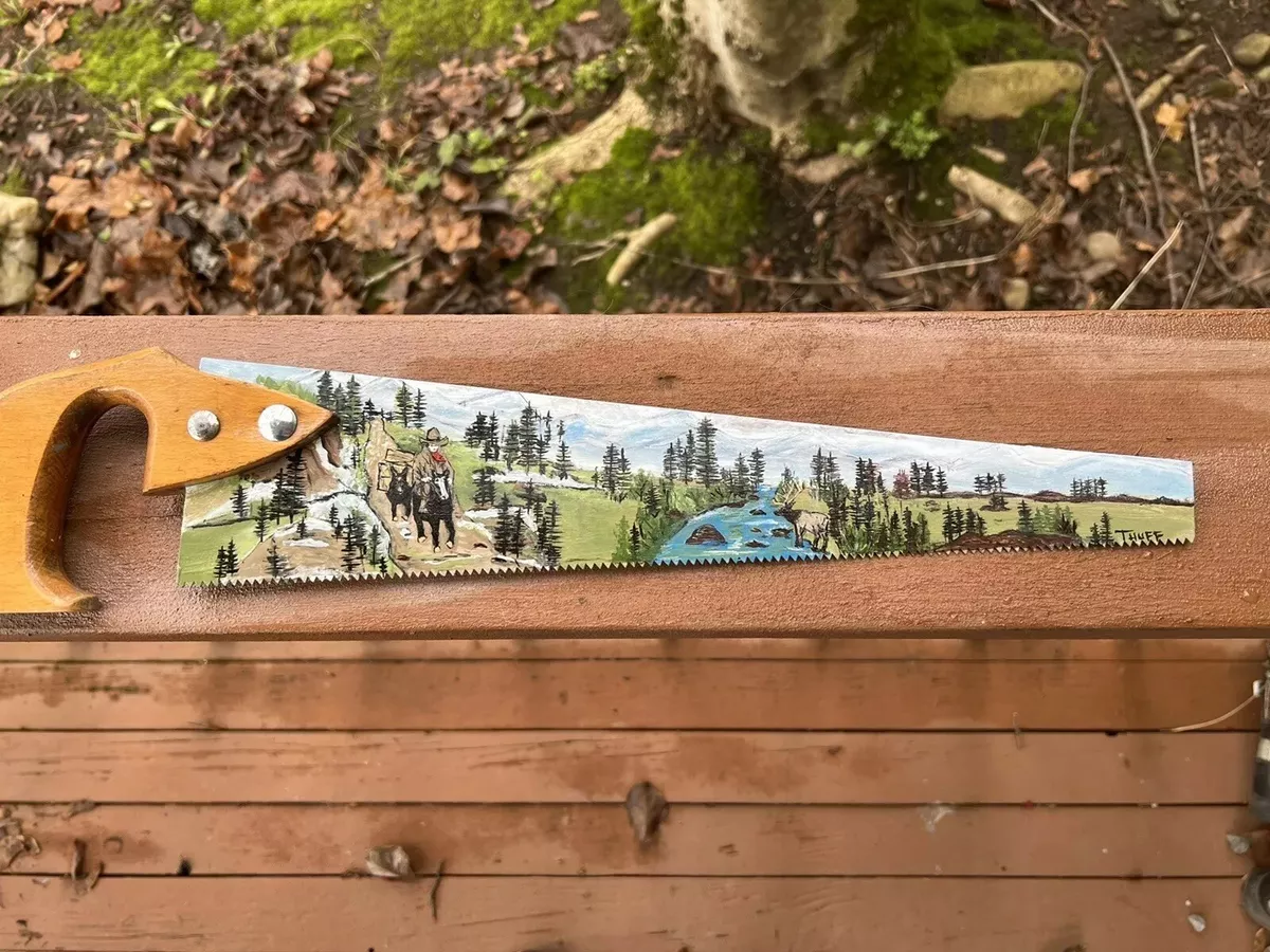 An original hand painted hand saw