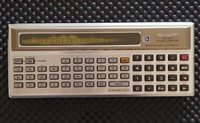 VINTAGE Sharp PC-1211 BASIC Pocket Computer PER PARTI DI RICAMBI 