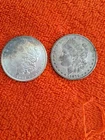(2) 1879,1904 Morgan Silver Dollars In Very Good Condition, 0 Mint Mark