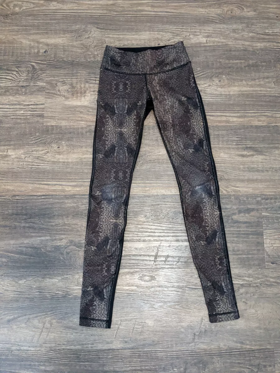 Womens lululemon leggings size 2 Gold and Black Metal or Beaded pattern