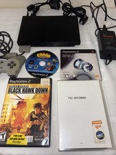 playstation 2 console slim with 2 games