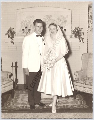 1955 Black And White Photo Of A Young Couple After They Have Gotten Married