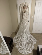 Ivory Lace Embroidered Long Sleeve Plunging Mermaid Wedding Dress with Train