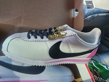 Nike Classic Cortez Premium in white, black, and rose.