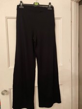 pair black wide leg stretch trousers M pull on