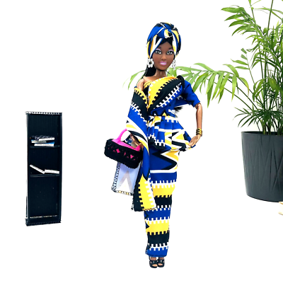 Beautiful African American Black Barbie doll with natural hair and a nice dress