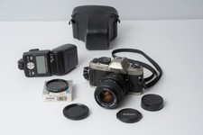 Mint Nikon FM10 35mm SLR Film Camera w/ 35-70 mm lens  Nikon Flash