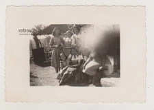 Family Photo of Women Interrupted by Photographer's Awkward Finger in the Frame