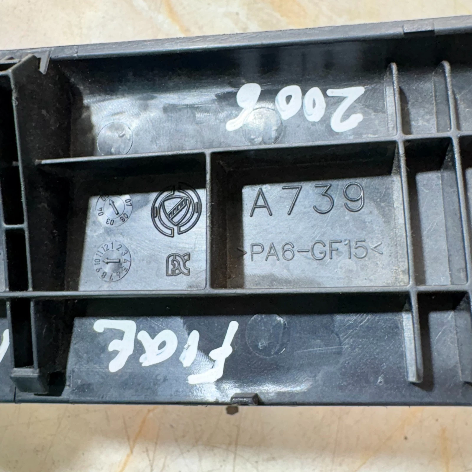 Fiat Idea door switch moulding A739 PA6-GF15 material marking