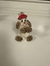 A set of three vintage Lefton spaghetti poodle figurines, including a planter