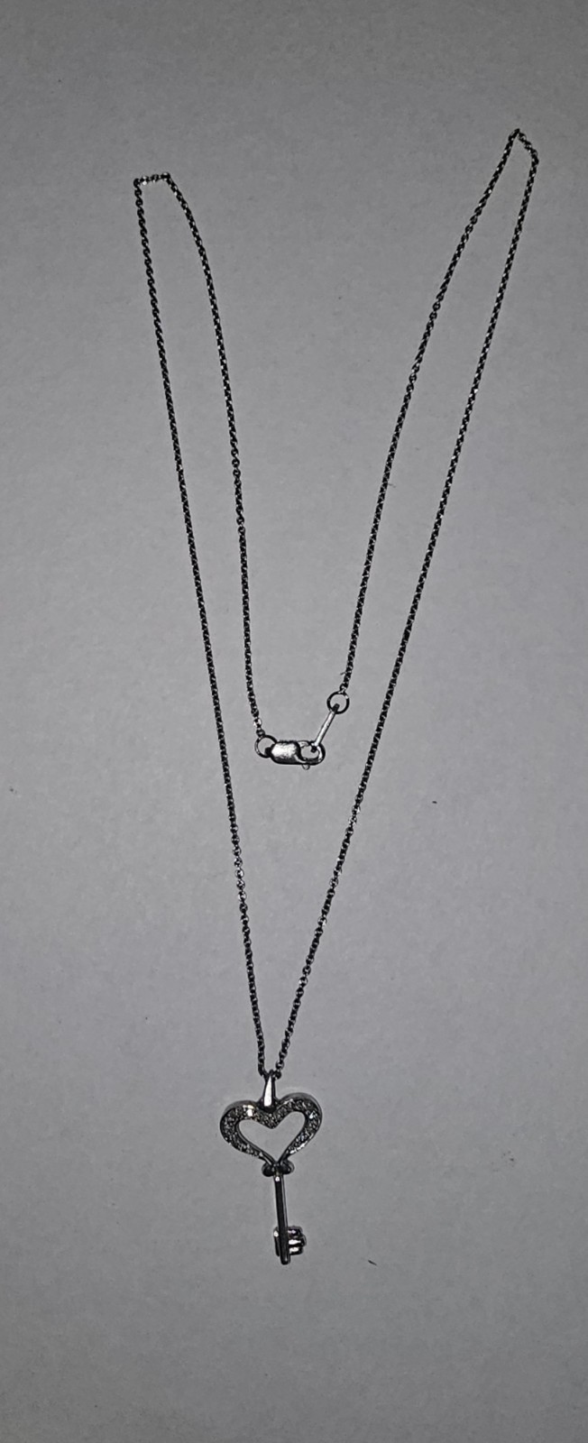 Zales 1/20 CT. T.W. Diamond Small Heart Key Pendant in Sterling Silver