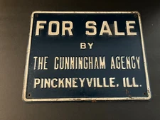 VINTAGE PINCKNEYVILLE, ILLINOIS METAL SIGN FOR SALE BY THE CUNNINGHAM AGENCY
