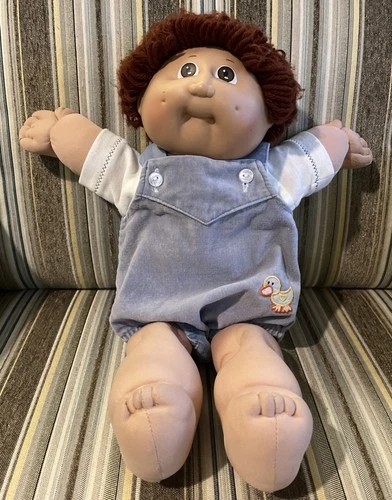 Cabbage Patch Boy, Reddish Yarn Hair, Brown Eyes. Outfit Has Duck Appliqué