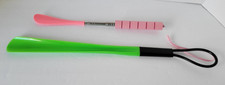 Shoe horns one is telesccoping to 28" the other is 19" new plastic Pink Green