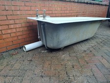Cast Iron Antique Bath With Claw Feet And Taps