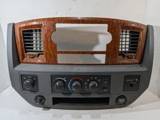 5KE76TRMAC 2006-2008 Dodge RAM Radio Bezel Dash Trim Panel Vent Woodgrain OEM