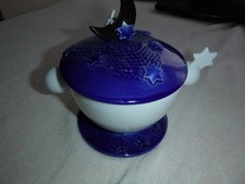 decorative porcelain jar in blue and white with lid, and star decor